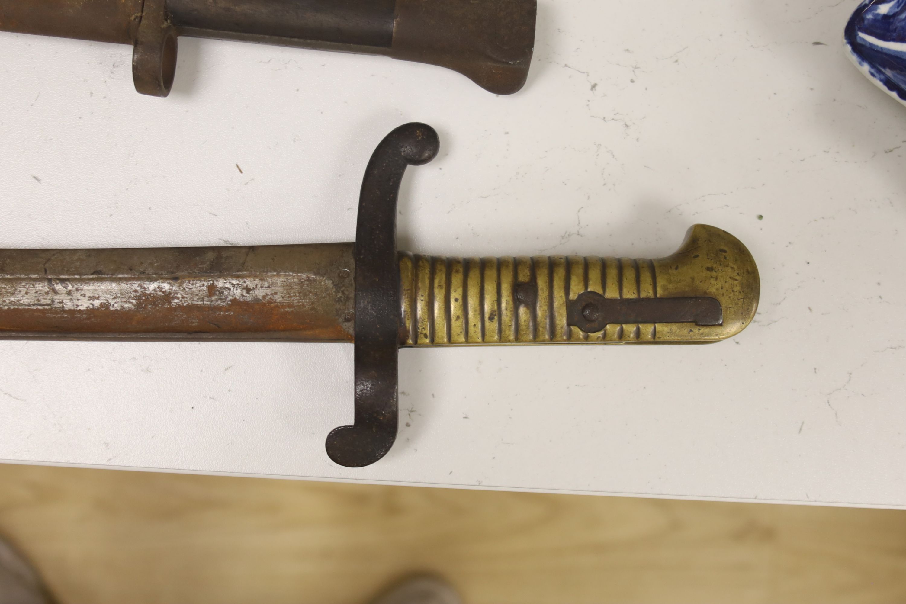 A 19th century French bayonet, together with an early 20th century English bayonet and a ‘Remember The Alamo 1836 The Stand of Colonel Jim' Bowie knife